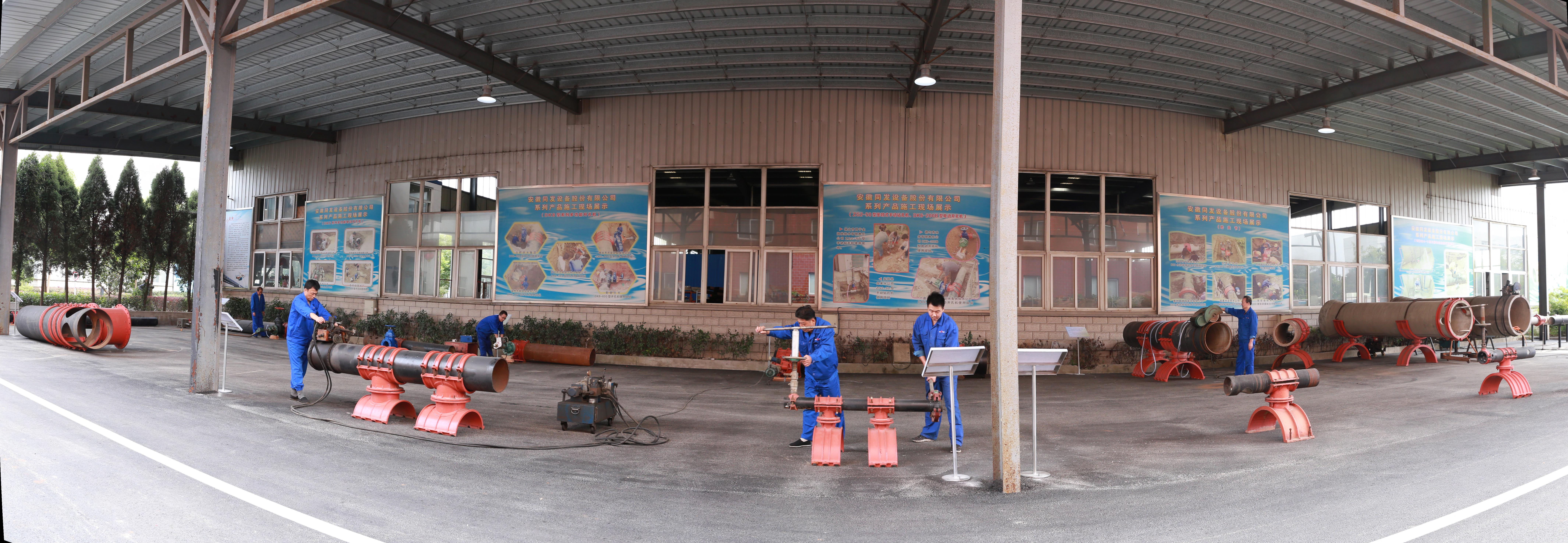 Workers assembling large-diameter pipe repair clamps at the Anhui Tongfa production line